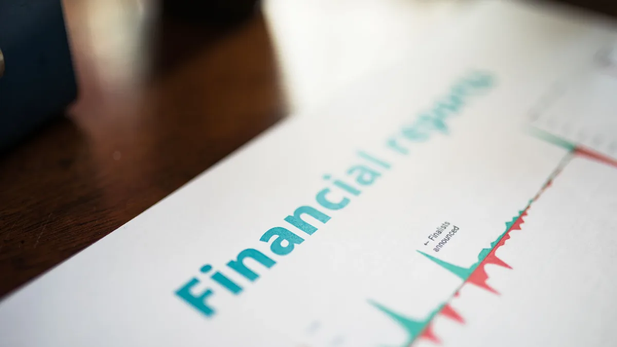 A financial report with a graph on a table.